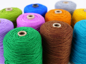 PolyTuft polyester tufting yarn cones in all 26 ultra-vivid colors